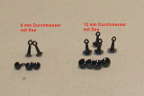 Kunststoff Bastelaugen, rund, schwarz mit Öse (9 bis 16 mm) Kunststoff Bastelaugen, rund, schwarz mit Öse (9 bis 16 mm)
